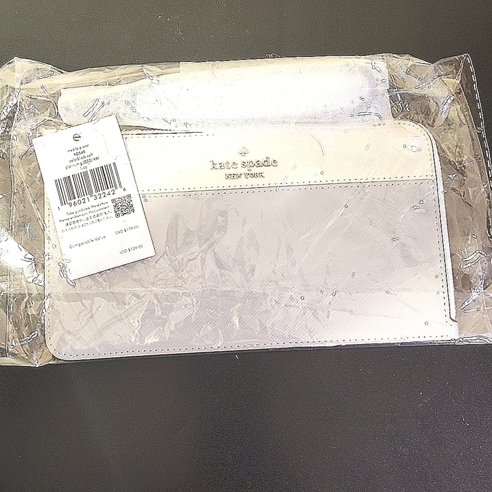 Kate Spade Lucy Medium L-Zip Wristlet in Platinum Gray and Cream.